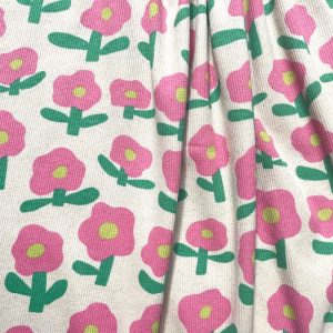 Tissu jersey côtelé fleurs rose fond écru