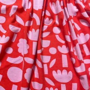 Tissu jersey gots fleurs rose fond orange