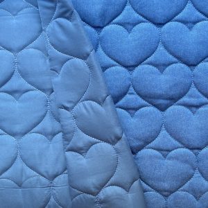 Tissu matelassé denim coeurs jeans bleu